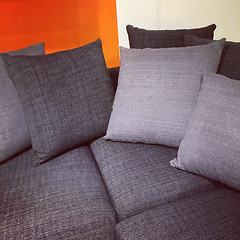 Image showing Gray sofa with lots of cushions