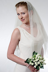 Image showing Beautiful Bride holding a bouquet