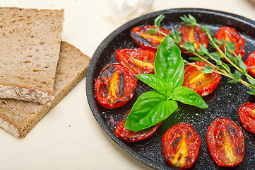 Image showing baked cherry tomatoes with basil and thyme