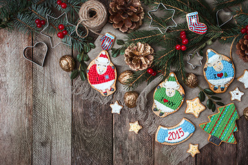 Image showing Christmas decoration and holiday cookies on wood