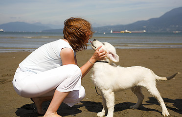 Image showing kiss to her dog