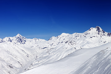 Image showing Snowy mountain peaks in sun nice day