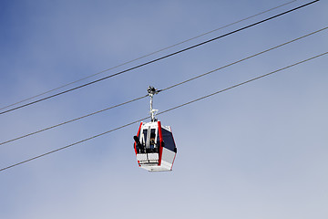 Image showing Gondola lift with ski and snowboards