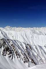 Image showing Snowy rocks in sun day