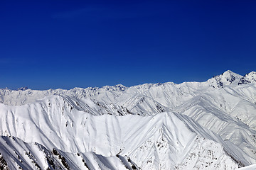 Image showing Snowy winter mountains in sun day