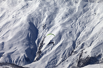 Image showing Speed riding in winter mountains at sun day