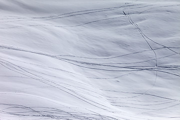 Image showing Off-piste slope with traces of skis and snowboarding