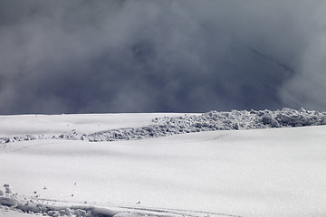 Image showing Sunlight off-piste slope and mountains in mist