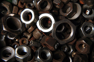 Image showing old steel nuts background