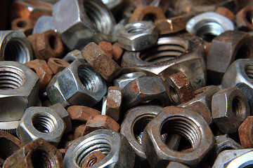 Image showing old steel nuts background