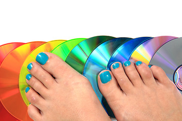 Image showing women feet (pedicure)  with cd and dvd 