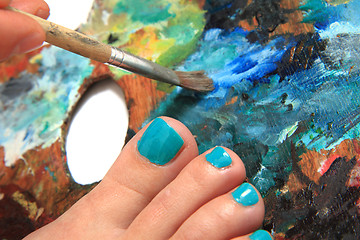 Image showing women feet (pedicure)  with color palette 