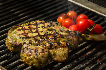 Image showing steak flame broiled on a barbecue