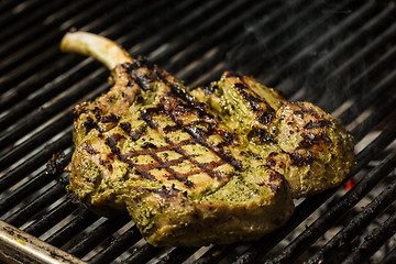 Image showing steak flame broiled on a barbecue