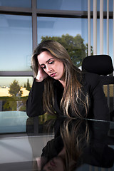 Image showing depressed at her desk