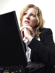 Image showing Business woman daydreaming