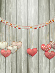 Image showing Red hearts hanging over old wood. EPS 10