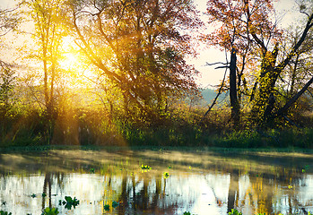 Image showing Bright sunrise over river