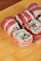 Image showing Sushi roll with bacon