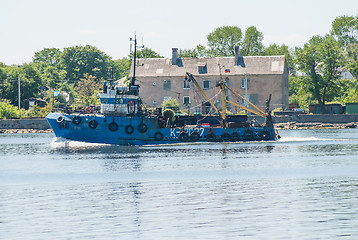 Image showing Fishing ship goes via Baltic sea channel to base