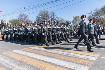 Image showing Company of police officers march on parade