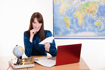 Image showing employee travel company with an airplane in hand