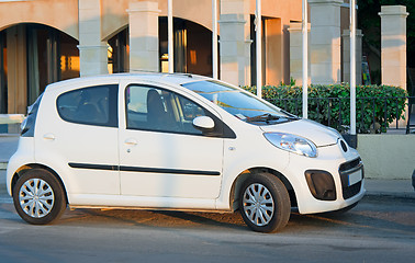 Image showing A small car in the Parking lot near the hotel.