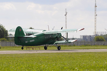 Image showing The green An-2 plane on a runway.