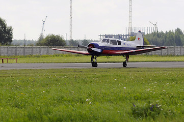 Image showing The Yak-18t plane on a runway.