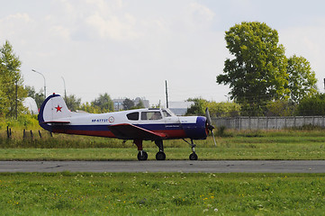 Image showing The Yak-18t plane on a runway.