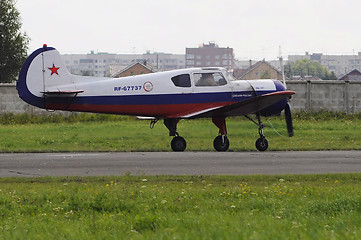 Image showing The Yak-18t plane on a runway.