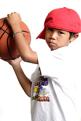Image showing Pensive boy holding a basketball
