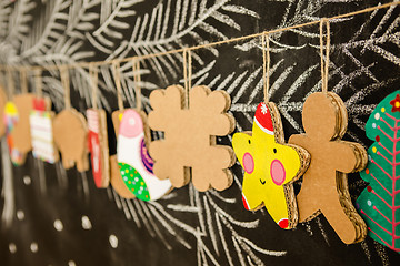 Image showing Cardboard toys for the Christmas tree or garland. Creative decorations. Selective Focus