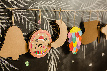 Image showing Cardboard toys for the Christmas tree or garland. Creative decorations. Selective Focus