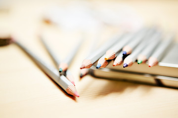 Image showing Close up of color pencils over wooden background