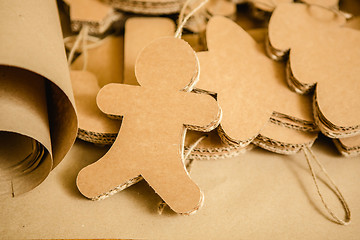 Image showing Cardboard toys for the Christmas tree or garland. Creative decorations. Selective Focus