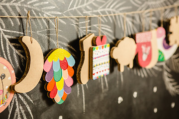 Image showing Cardboard toys for the Christmas tree or garland. Creative decorations. Selective Focus