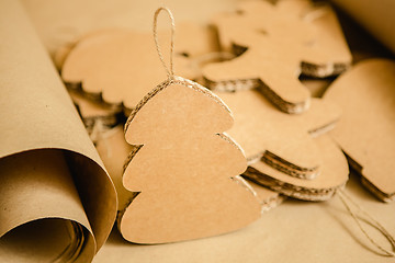 Image showing Cardboard toys for the Christmas tree or garland. Creative decorations. Selective Focus