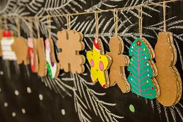 Image showing Cardboard toys for the Christmas tree or garland. Creative decorations. Selective Focus