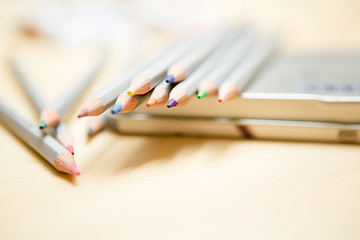 Image showing Close up of color pencils over wooden background