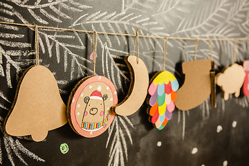 Image showing Cardboard toys for the Christmas tree or garland. Creative decorations. Selective Focus