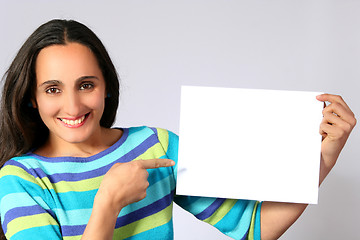 Image showing Woman holding a blank paper