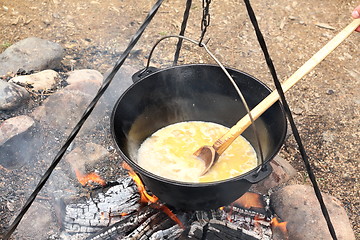 Image showing black cauldron on camping fire