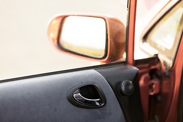 Image showing Car door interior with rearview mirror