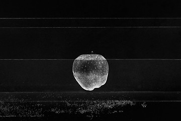 Image showing Small apple in see trough water