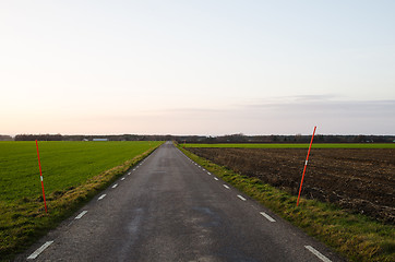 Image showing Country road with snow spokes