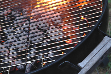 Image showing bbq flames through the grid