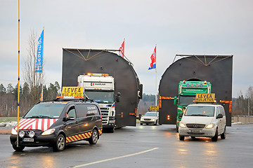 Image showing Pilot Cars and Two Trucks Hauling Oversize Loads