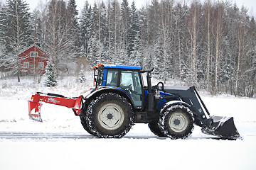 Image showing Valtra Tractor Removes Snow with Bucket and Road Drag