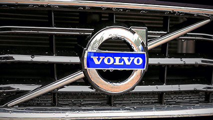 Image showing Volvo Sign on the Grille of the Car in the Rain